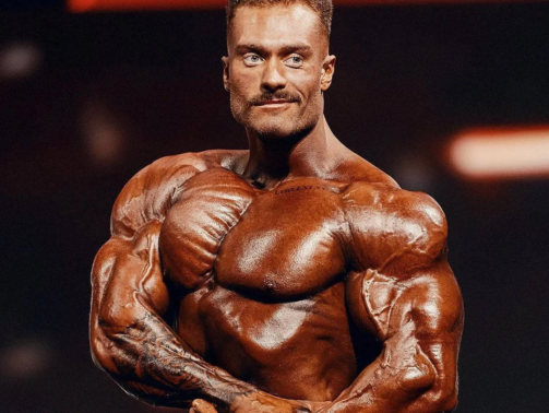 tanned-chris-bumstead-side-chest.webp